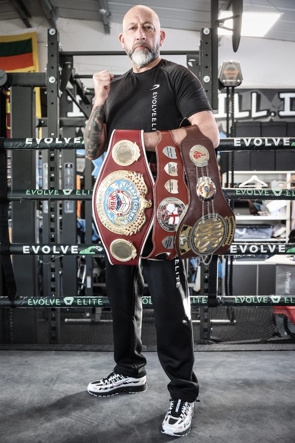 Andy Gill with championship belts