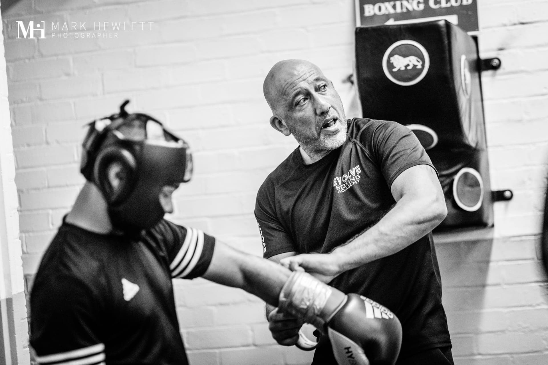 Head coach Andy Gill working with a junior at Evolve Boxing Academy
